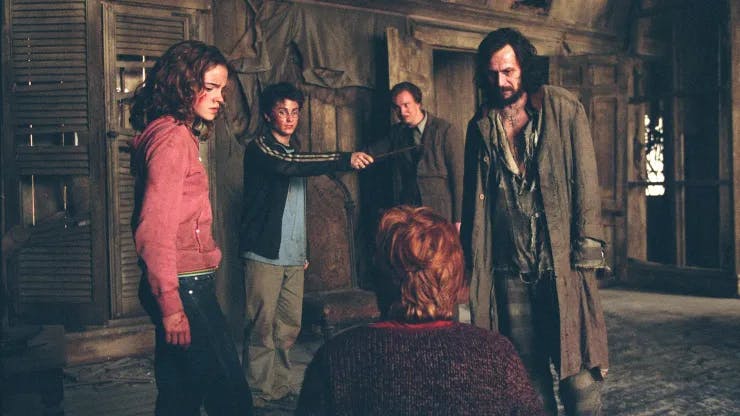 (L-r) EMMA WATSON as Hermione Granger, DANIEL RADCLIFFE as Harry Potter, DAVID THEWLIS as Professor Lupin (background), GARY OLDMAN as Sirius Black and RUPERT GRINT as Ron Weasley (back to                   camera) in Warner Bros. PicturesÕ fantasy ÒHarry Potter and the Prisoner of  Azkaban.Ó  Photo by Murray Close.
PHOTOGRAPHS TO BE USED SOLELY FOR ADVERTISING, PROMOTION, PUBLICITY OR REVIEWS OF THIS SPECIFIC MOTION PICTURE AND TO REMAIN THE PROPERTY OF THE STUDIO. NOT FOR SALE OR REDISTRIBUTION.
